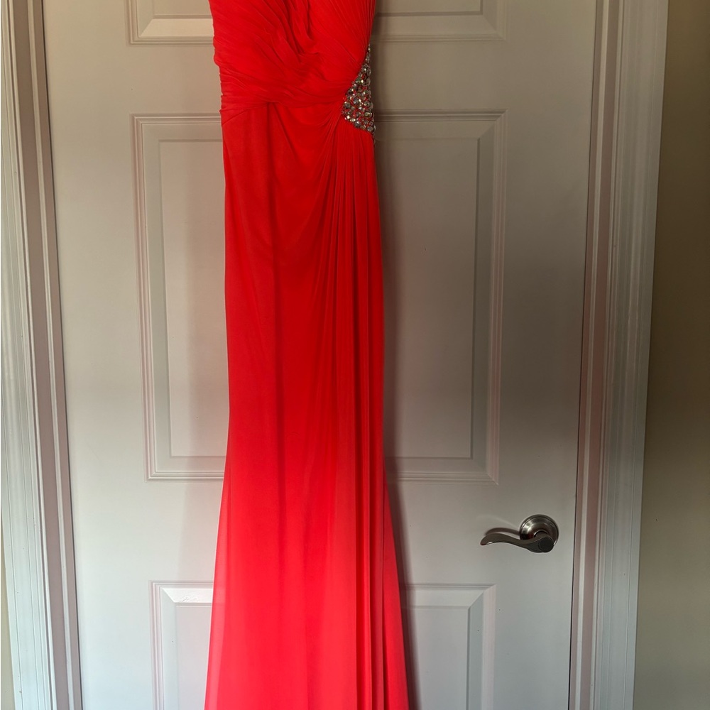 Peachy/Coral prom dress with slit.